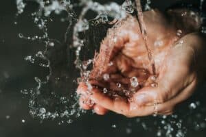 Hands catching water
